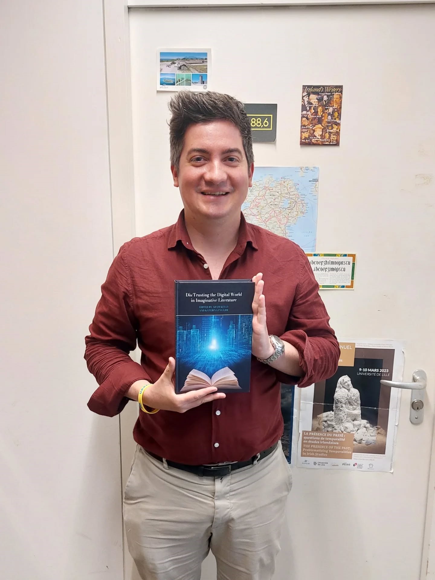 Dr. Runstedler holding a book