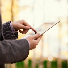 Someone searching on a tablet