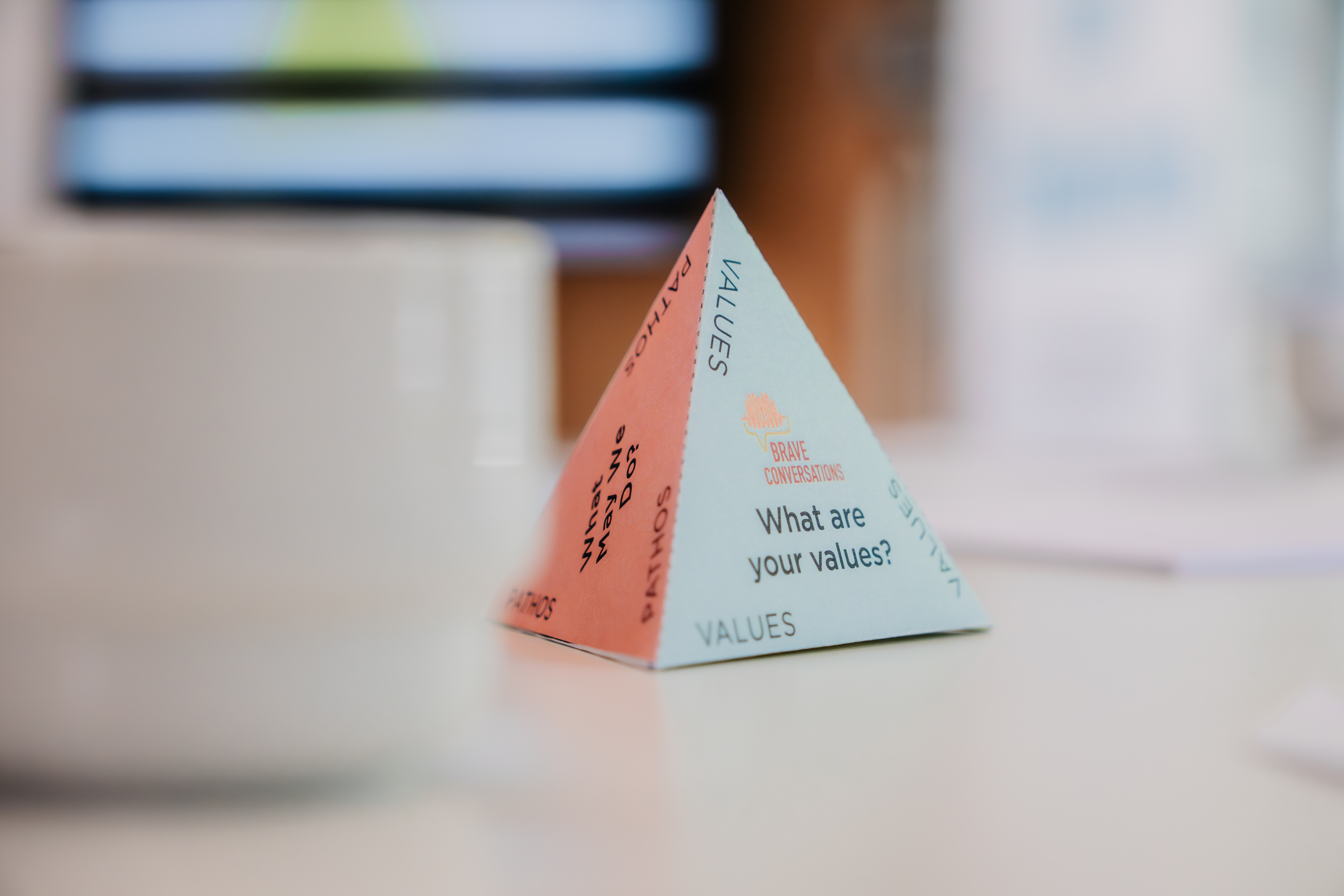 a pyramid of paper on the table